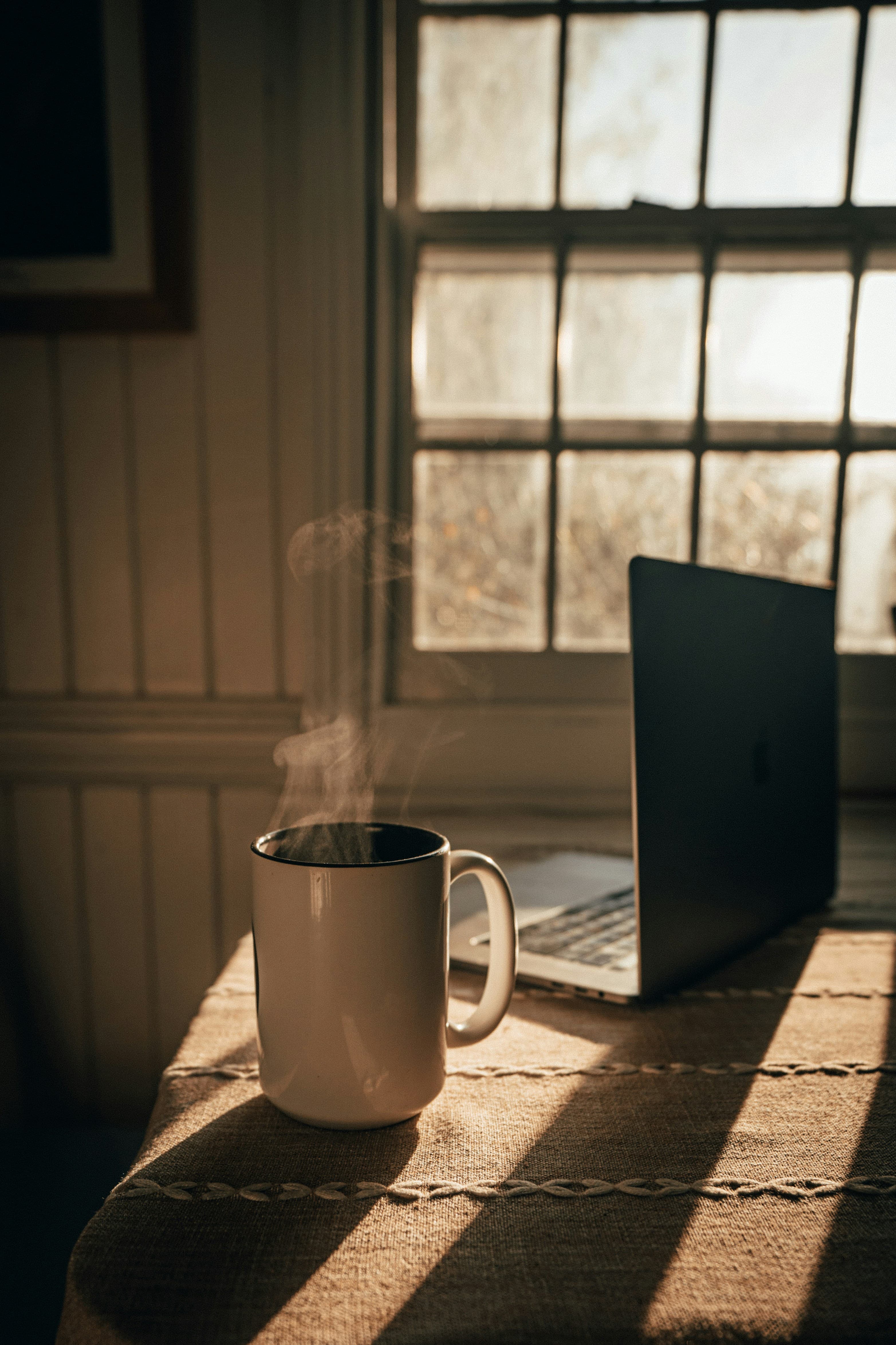 A quiet creative workspace—papers, light, and open space for thought.
